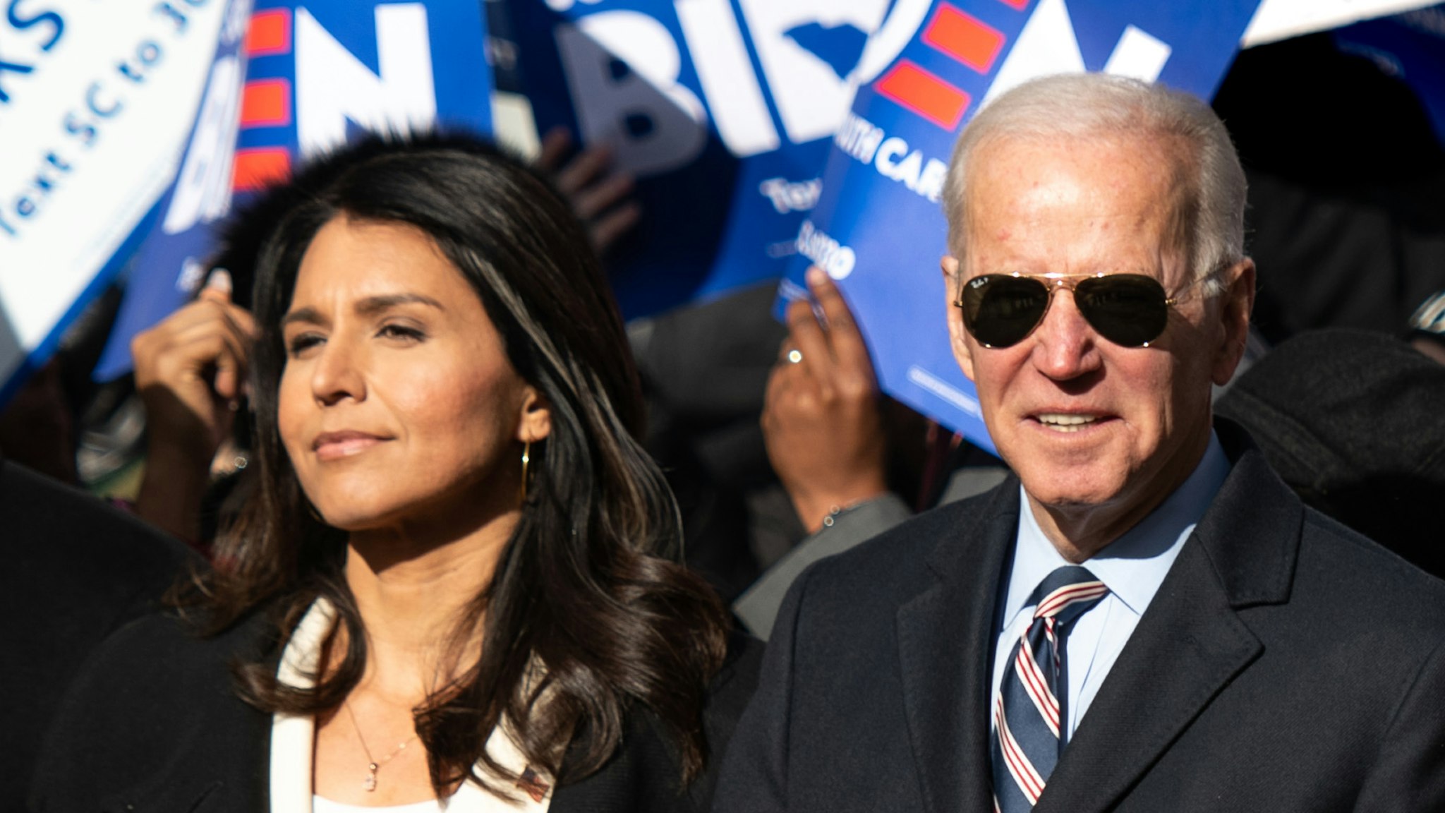 COLUMBIA, SC - JANUARY 20: Democratic presidential candidates, Rep. Tulsi Gabbard (D-HI), left, former Vice President Joe Biden, Sen. Amy Klobuchar (D-MN), Sen. Elizabeth Warren (D-MA), and Sen. Bernie Sanders (I-VT), right, march on Main St. to the King Day at the Dome event with Democratic candidate for U.S. Senate Jaime Harrison, far left, on January 20, 2020 in Columbia, South Carolina. The event, first held in 2000 in opposition to the display of the Confederate battle flag at the statehouse, attracted more than a handful of Democratic presidential candidates to the early primary state.
