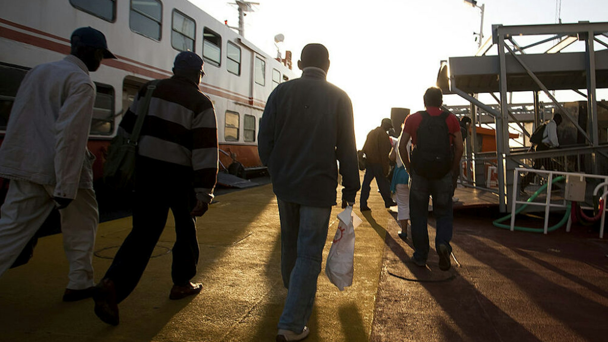 Commuters exit the ferry at Cacilhas station after crossing the river Tejo in Lisbon, Portugal, on Wednesday, June 1, 2011. Portugal's elections may produce a political stalemate that slows implementation of the austerity measures needed to trim the euro-region's fourth-biggest debt and tap 78 billion euros ($109 billion) of bailout funds.
