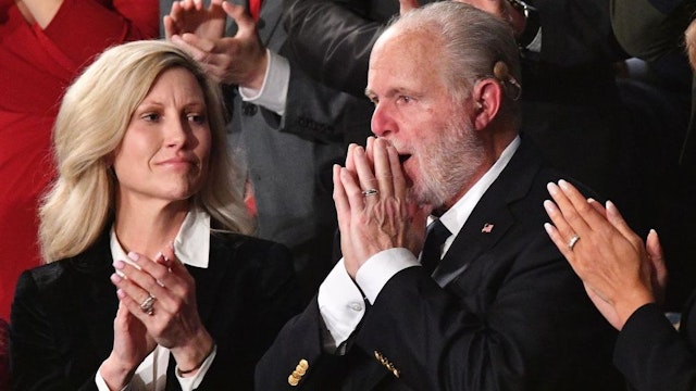 Radio personality Rush Limbaugh gestures after being awarded the Medal of Freedom by US President Donald Trump as he delivers the State of the Union address at the US Capitol in Washington, DC, on February 4, 2020.