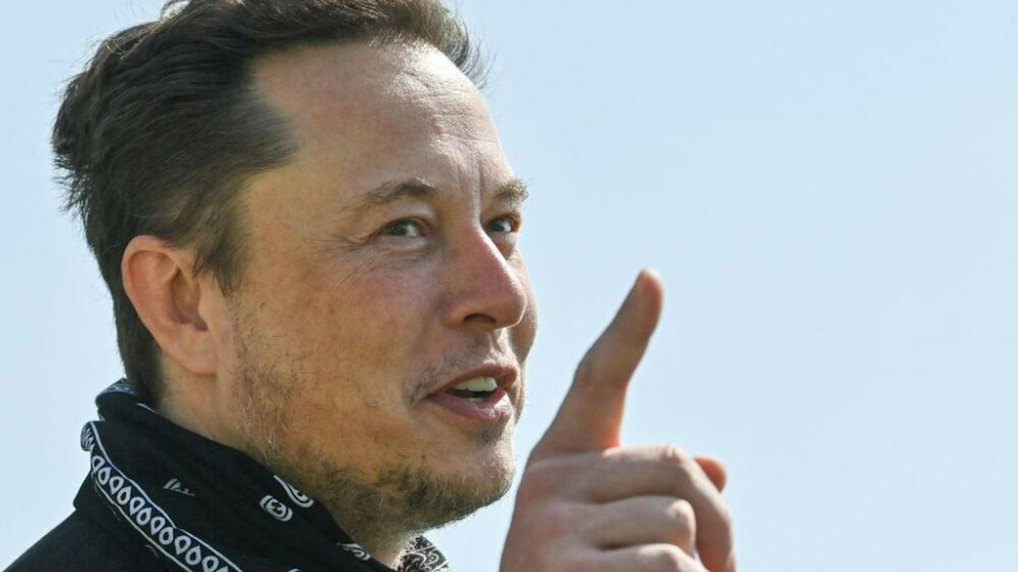 US entrepreneur and business magnate Elon Musk gestures during a visit at the Tesla Gigafactory plant under construction, on August 13, 2021 in Gruenheide near Berlin, eastern Germany.