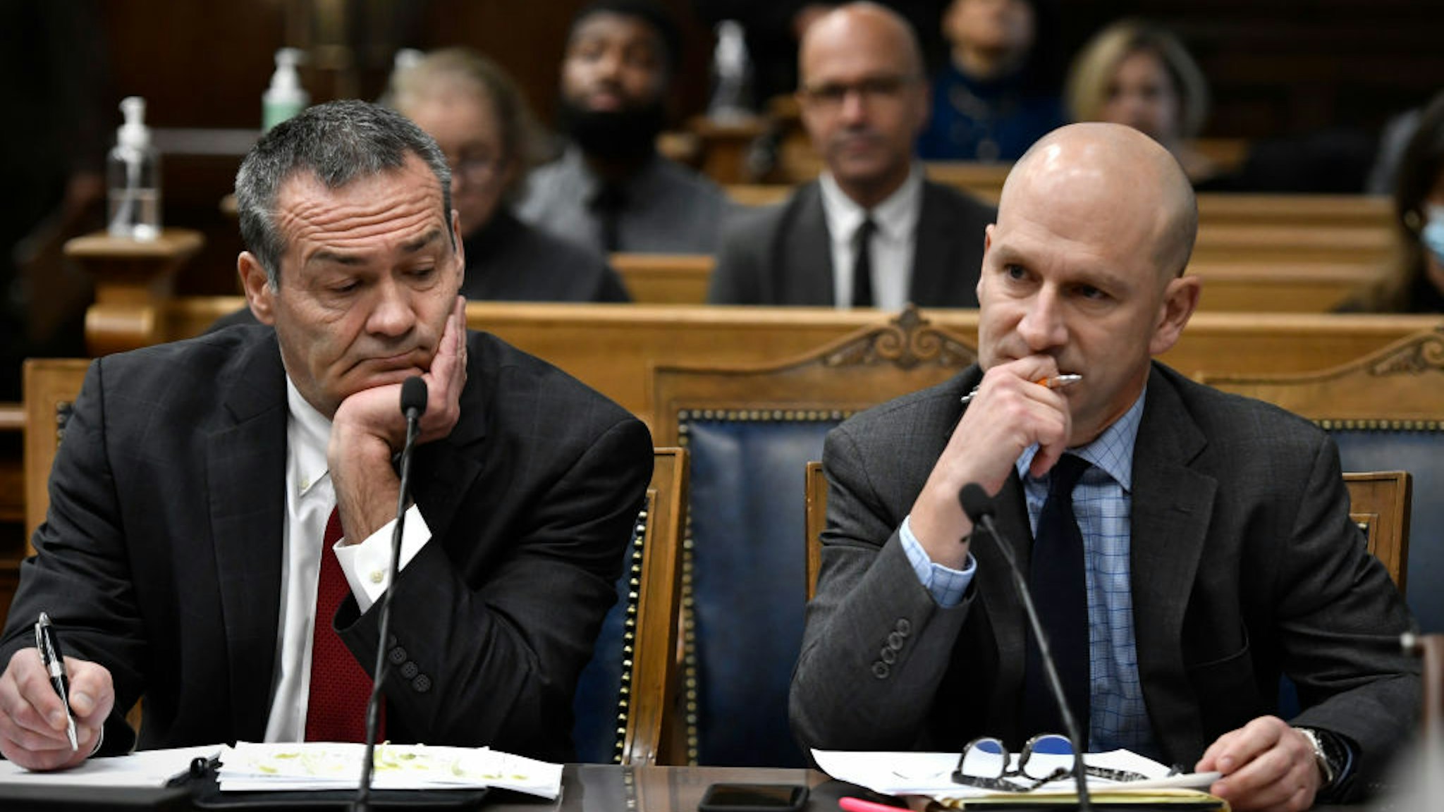 Mark Richards (L) and Corey Chirafisi, Kyle Rittenhouse's attorneys, listen as Judge Bruce Schroeder talks during his trial at the Kenosha County Courthouse on November 16, 2021 in Kenosha, Wisconsin.