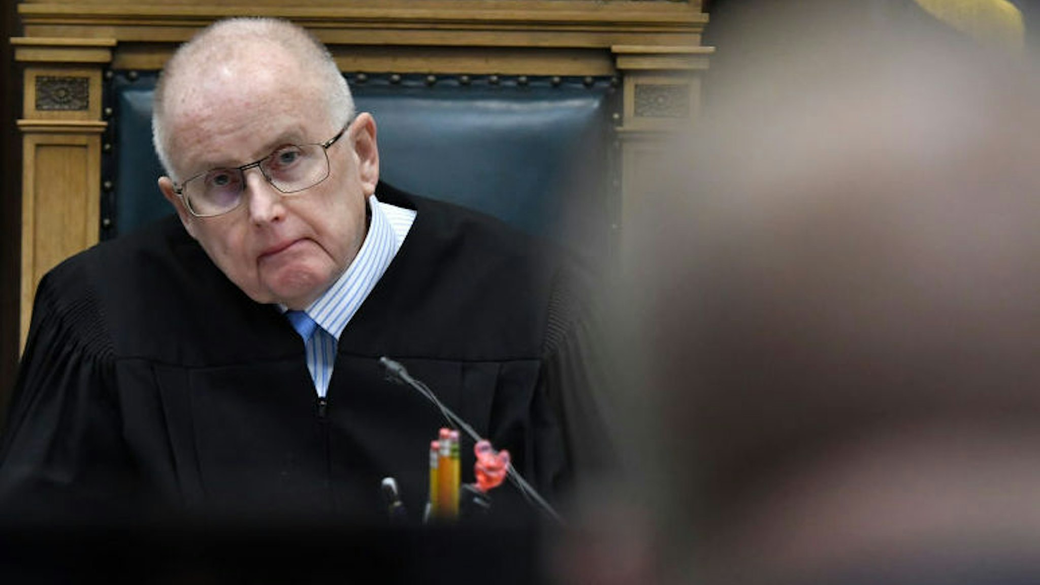 Judge Bruce Schroeder listens as Assistant District Attorney James Kraus speaks about an evidence video provided by the prosecution in Kyle Rittenhouse's trial at the Kenosha County Courthouse on November 17, 2021 in Kenosha, Wisconsin.