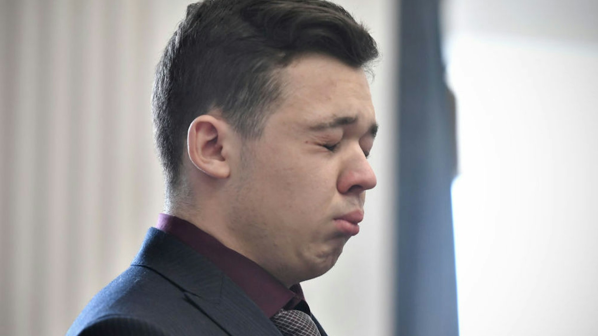 Kyle Rittenhouse closes his eyes and cries as he is found not guilty on all counts at the Kenosha County Courthouse on November 19, 2021 in Kenosha, Wisconsin.
