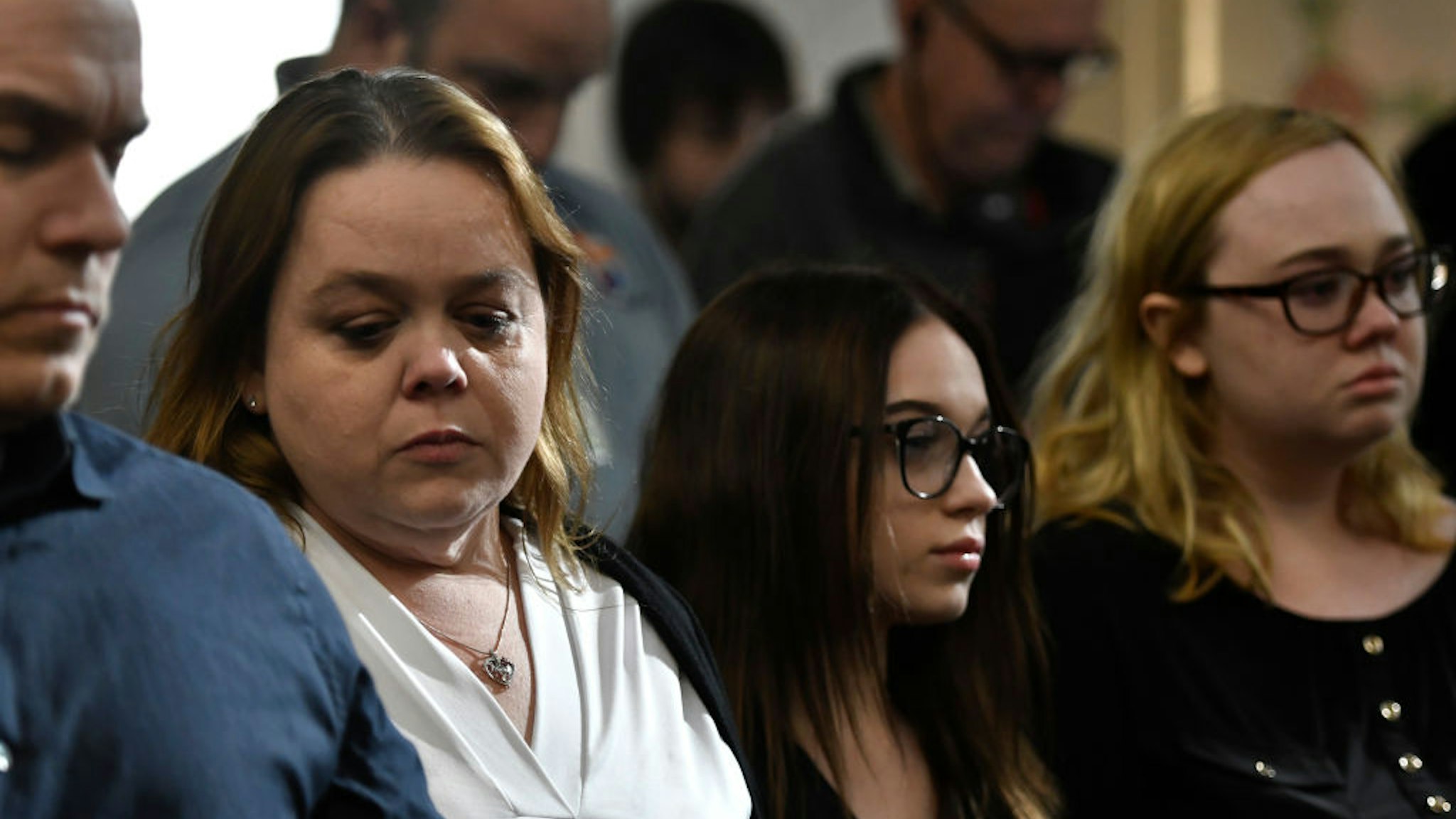 Kyle Rittenhouse's mother, Wendy Rittenhouse, second from left, and his sisters, McKenzie, and Faith nervously wait as the jury enters the room to give the verdicts in Kyle Rittenhouse's trial at the Kenosha County Courthouse on November 19, 2021 in Kenosha, Wisconsin.