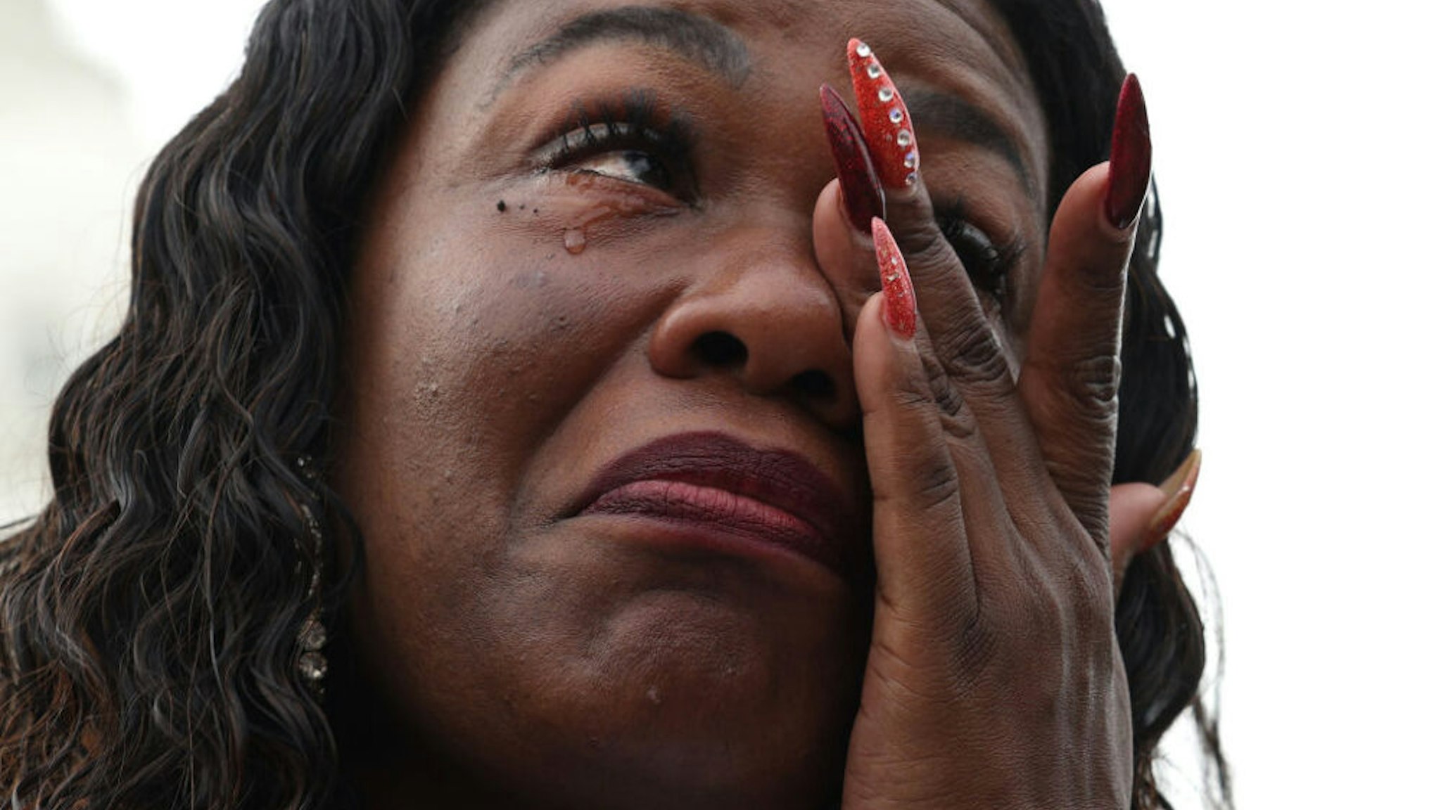 WASHINGTON, DC - AUGUST 03: U.S. Rep. Cori Bush (D-MO) becomes emotional during a news conference on the eviction moratorium at the Capitol on August 03, 2021 in Washington, DC. News organizations reported that the Biden Administration plans to institute a new eviction moratorium for areas with high levels of COVID-19, days after Bush started camping out on the steps of the Capitol Building to protest the end of the Centers for Disease Control and Prevention's original moratorium.