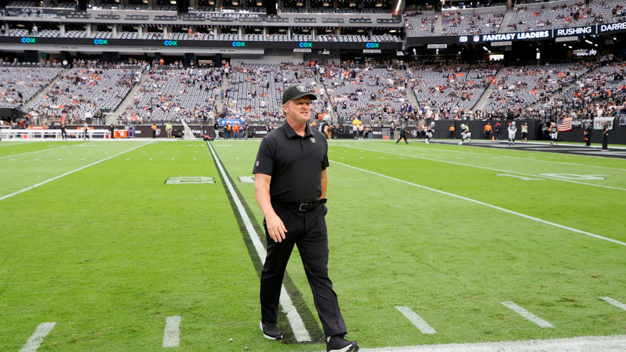 LAS VEGAS, NEVADA - OCTOBER 10: Head coach John Gruden of the Las Vegas Raiders walks on the field before a game against the Chicago Bears at Allegiant Stadium on October 10, 2021 in Las Vegas, Nevada. (Photo by Ethan Miller/Getty Images)
