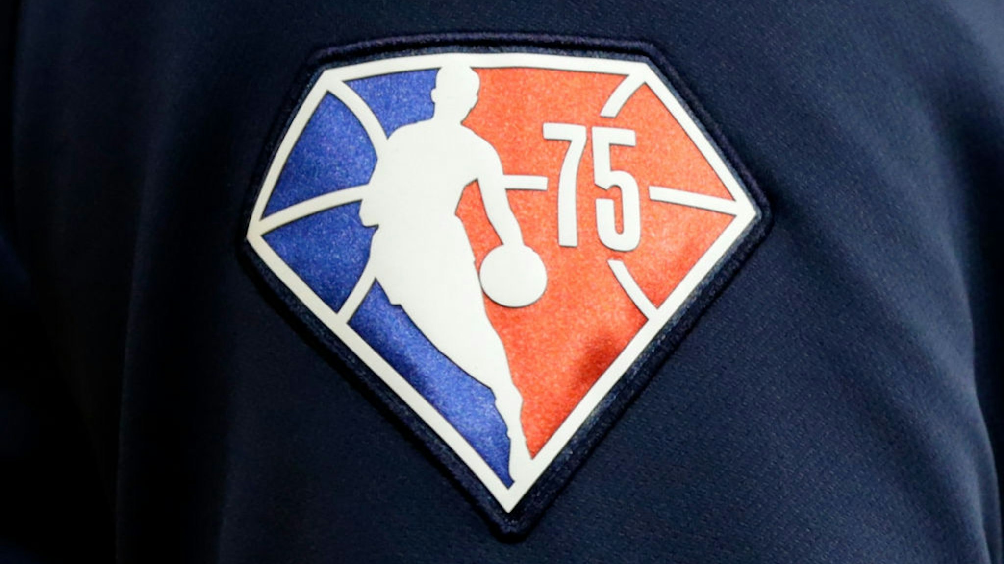 A detailed view of the 75th anniversary logo worn by a Utah Jazz player before the game against the Milwaukee Bucks at Fiserv Forum on October 31, 2021 in Milwaukee, Wisconsin. Jazz defeated the Bucks 107-95.