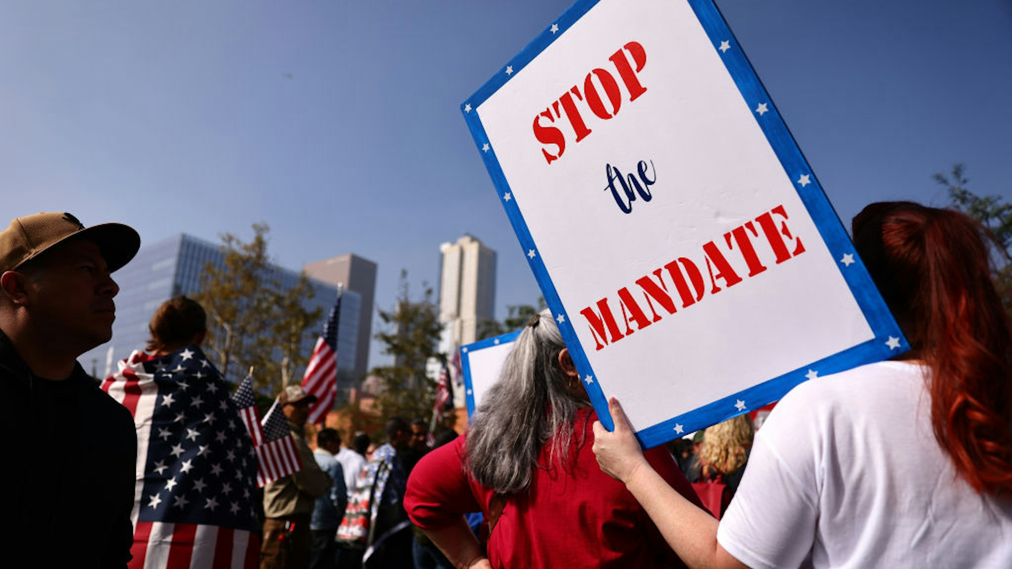 LOS ANGELES, CALIFORNIA - NOVEMBER 08: Protestors gather in Grand Park at a ‘March for Freedom’ rally demonstrating against the L.A. City Council’s COVID-19 vaccine mandate for city employees and contractors on November 8, 2021 in Los Angeles, California. The City Council has set a deadline of December 18 for all city employees and contractors to be vaccinated except for those who have religious or medical exemptions.