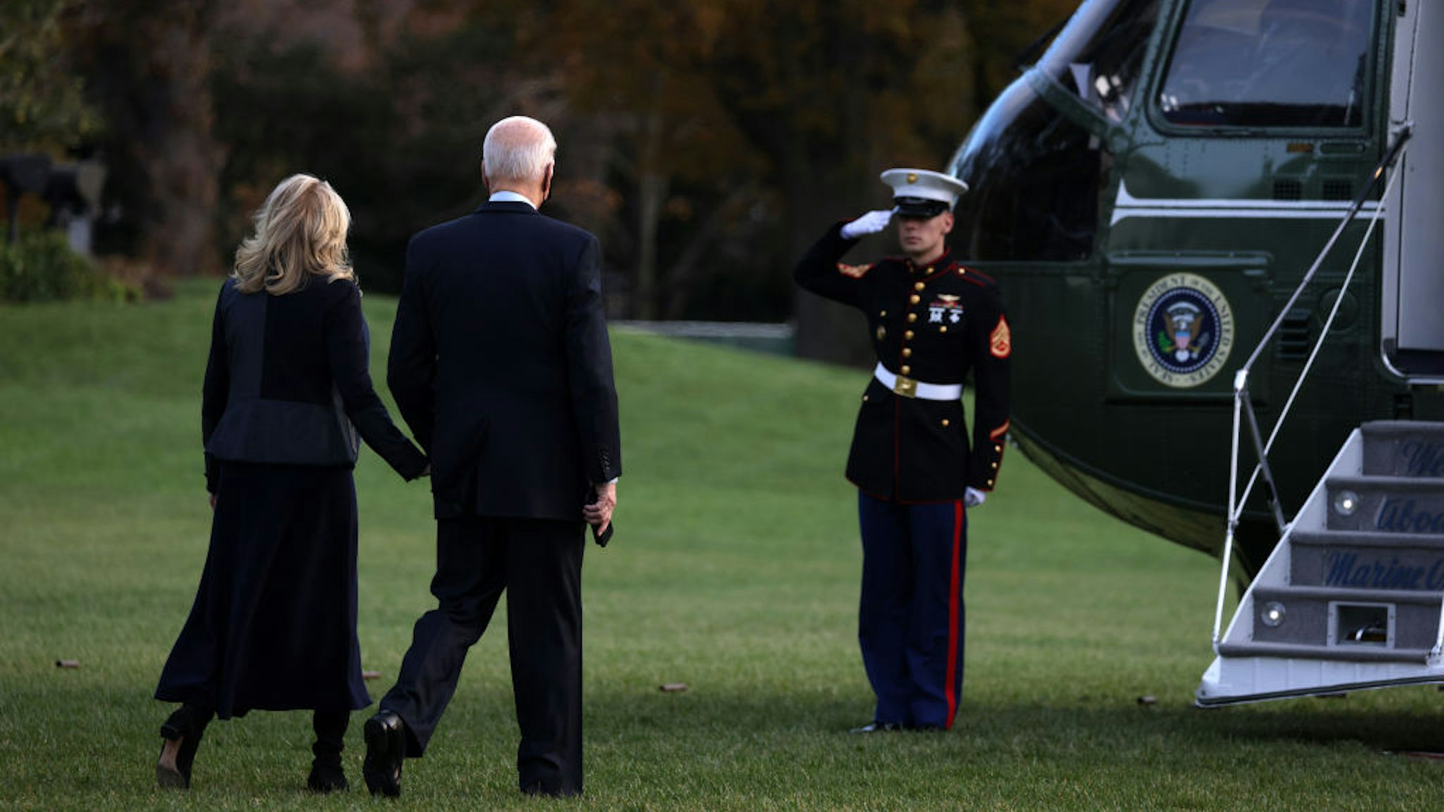 WASHINGTON, DC - NOVEMBER 22: U.S. President Joe Biden and first lady Jill Biden walk toward the Marine One for a South Lawn departure from the White House November 22, 2021 in Washington, DC. President Biden and the first lady are traveling to Fort Bragg, North Carolina, to celebrate Friendsgiving with service members and military families. (Photo by Alex Wong/Getty Images)