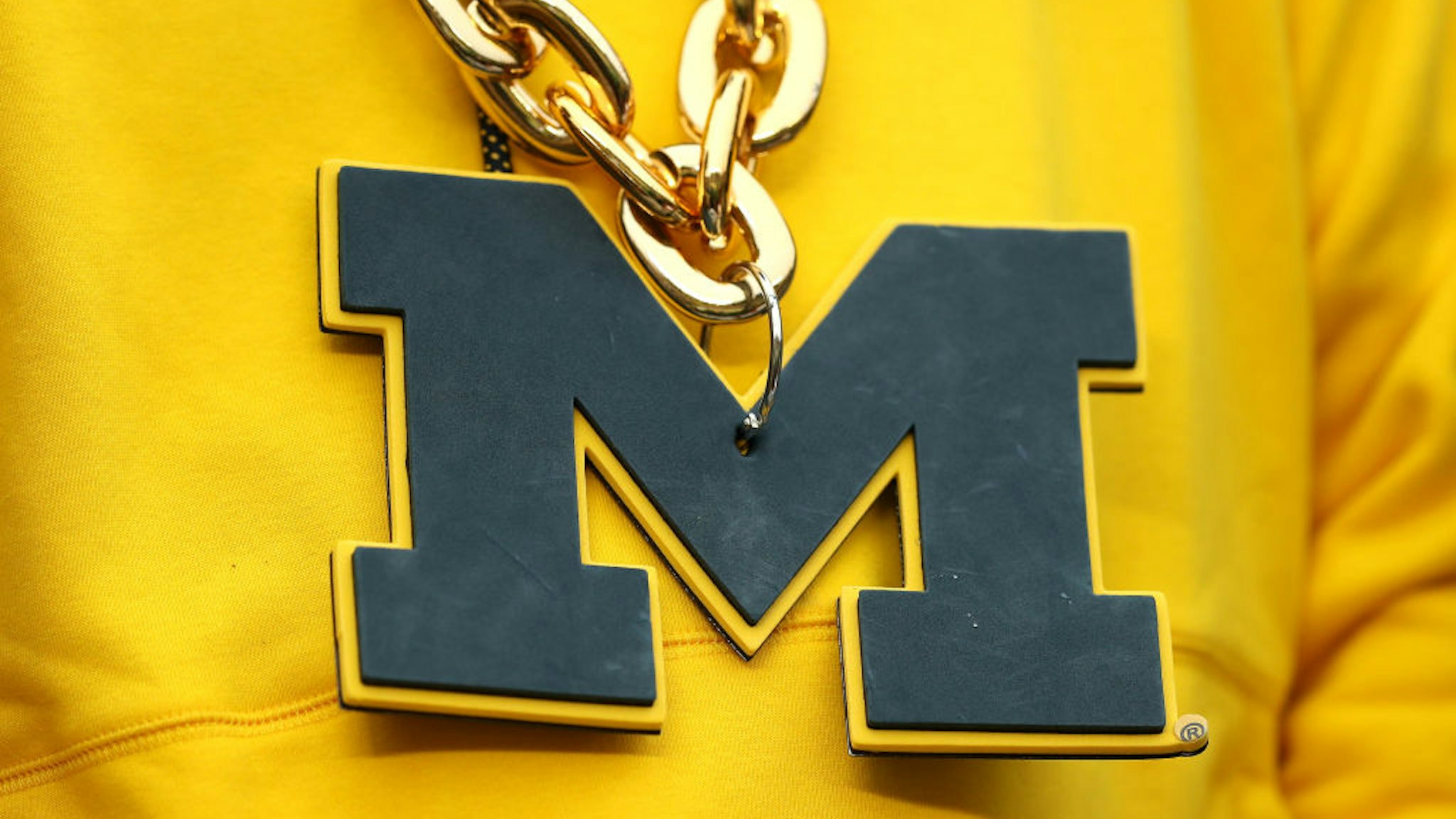 ANN ARBOR, MICHIGAN - NOVEMBER 27: Detail of a Michigan Wolverines necklace during the game against the Ohio State Buckeyes at Michigan Stadium on November 27, 2021 in Ann Arbor, Michigan. (Photo by Mike Mulholland/Getty Images)