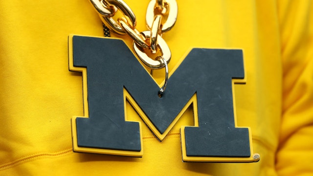 ANN ARBOR, MICHIGAN - NOVEMBER 27: Detail of a Michigan Wolverines necklace during the game against the Ohio State Buckeyes at Michigan Stadium on November 27, 2021 in Ann Arbor, Michigan. (Photo by Mike Mulholland/Getty Images)