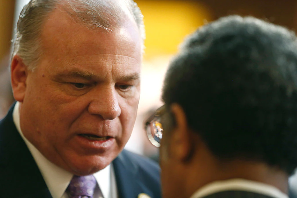 New Jersey Senate President Steve Sweeney speaks to a colleague prior to New Jersey Gov. Chris Christie delivering his budget address for fiscal year 2016 to the Legislature, February 24, 2015 at the Statehouse in Trenton, New Jersey.