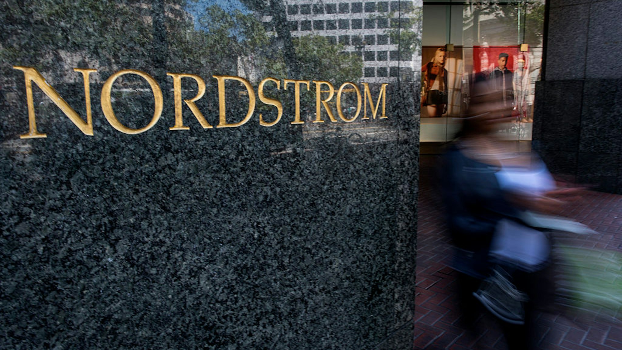 A shopper exits a Nordstrom Inc. store at the Westfield San Francisco Shopping Centre in San Francisco, California, U.S., on Tuesday, May 12, 2015.