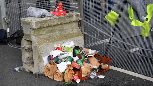 Rubbish is pictured pile up against the inside of the perimeter fence during the COP26 UN Climate Change Conference in Glasgow, Scotland on November 2, 2021.