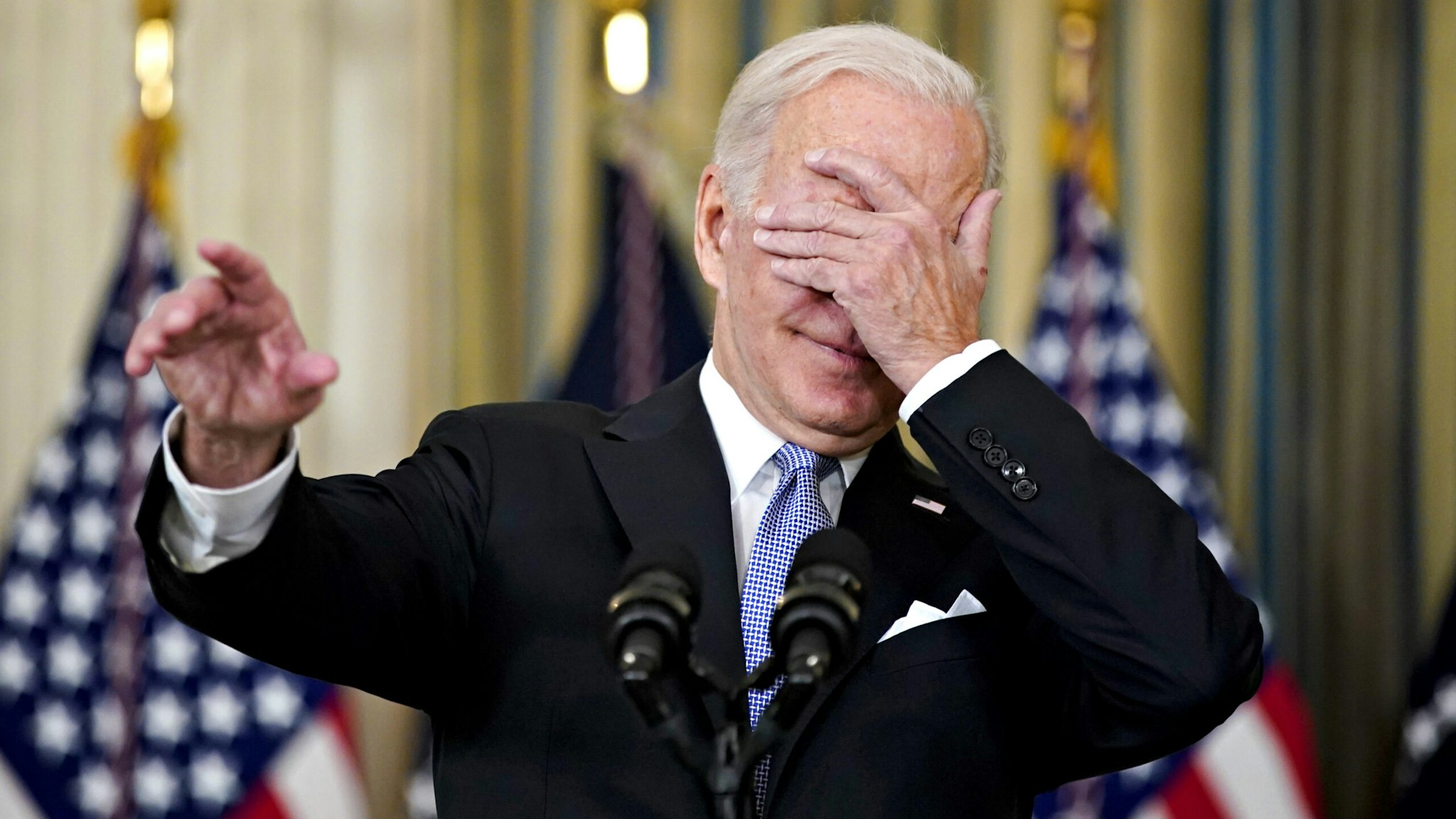 U.S. President Joe Biden covers his eyes to choose a reporter to ask a question after speaking on the passage of the Bipartisan Infrastructure Deal in the State Dining Room of the White House in Washington, D.C., U.S., on Saturday, Nov. 6, 2021. The House on Friday passed the biggest U.S. infrastructure package in decades, marking a victory for President Biden and unleashing $550 billion of fresh spending on roads, bridges, public transit and other projects in coming years.