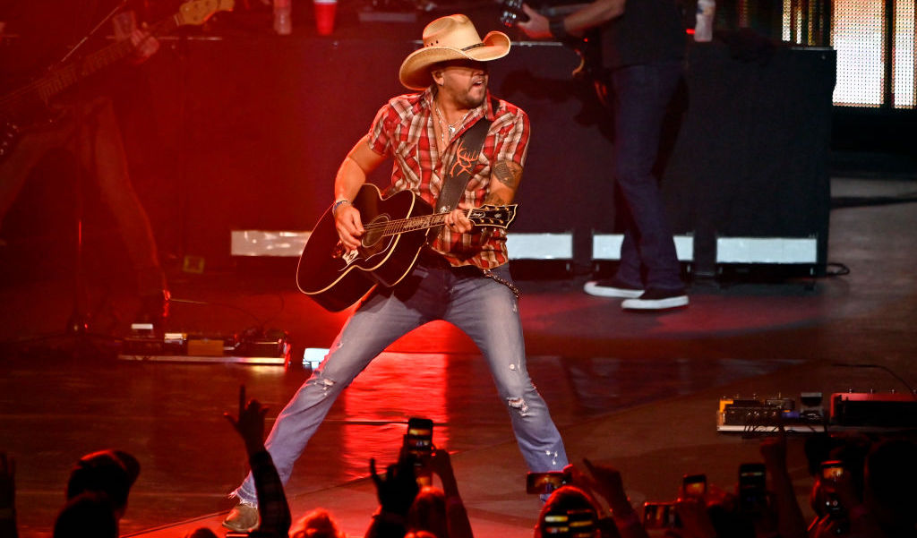 Country artist Jason Aldean tops music chart, marking historic domination by country musicians.