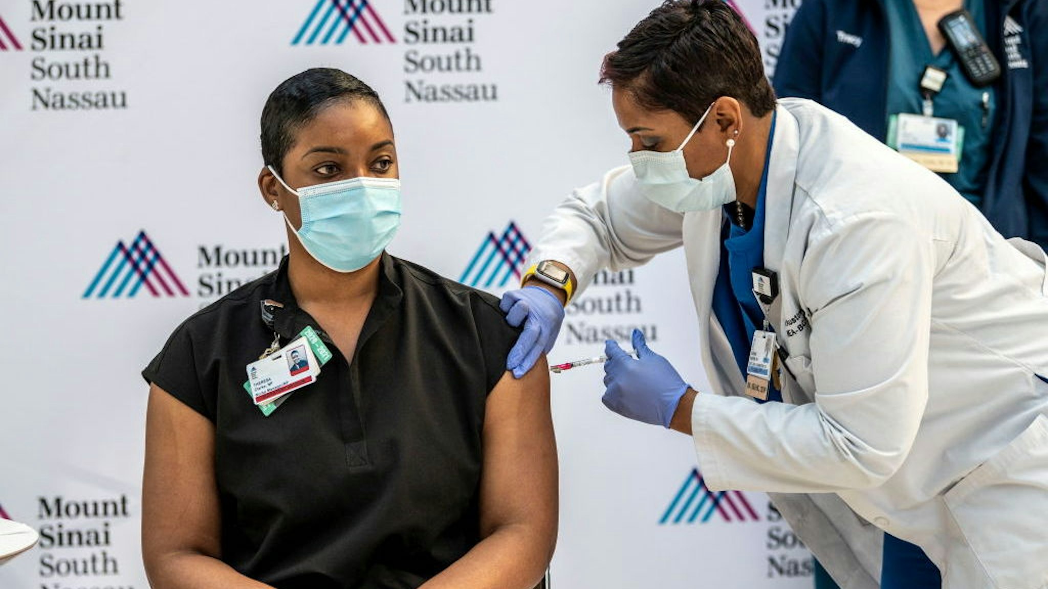 Oceanside, N.Y.: Theresa Clarke, Nurse Manager at Mount Sinai South Nassau hospital is the first staff member to get the COVID-19 vaccination on Dec. 15, 2020 in Oceanside, New York. (Photo by Alejandra Villa Loraca/Newsday via Getty Images)