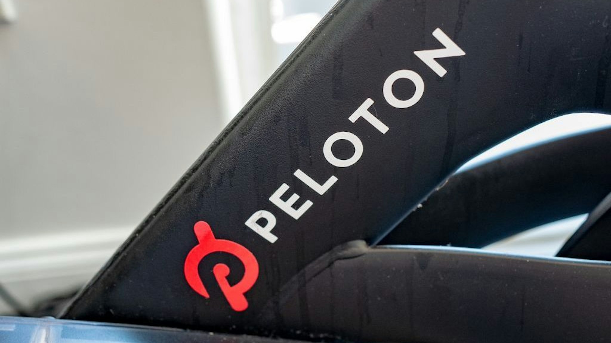Close-up of logo for Peloton on exercise bicycle, San Francisco, California, June 14, 2021. (Photo by Smith Collection/Gado/Getty Images)