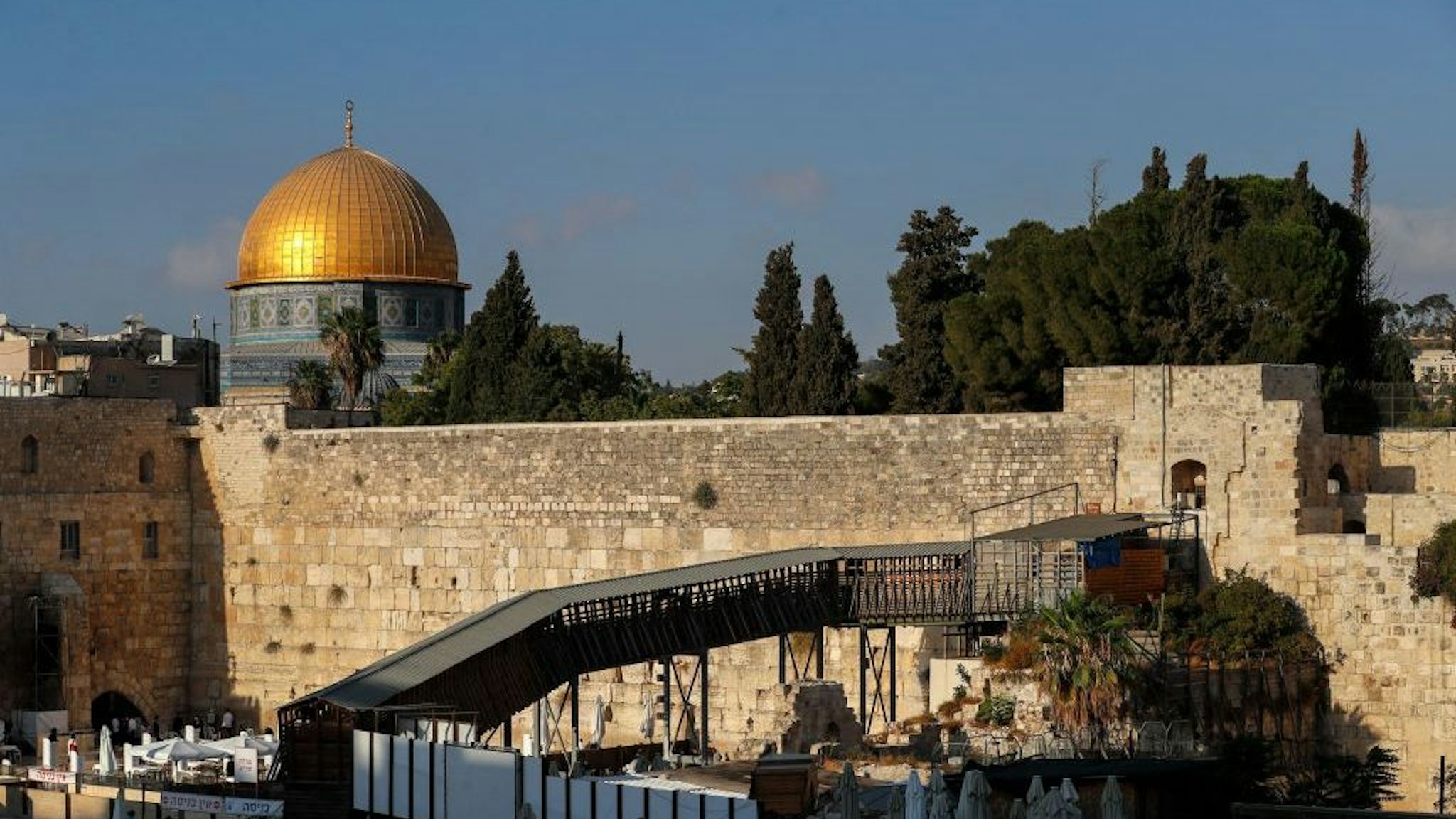 This picture shows the Mughrabi ramp, leading from the Western Wall (Wailing Wall) to the Al-Aqsa Mosque compound that includes the Dome of the Rock Mosque (background) in Jerusalem's Old City, on September 10, 2021. (Photo by AHMAD GHARABLI / AFP) (Photo by AHMAD GHARABLI/AFP via Getty Images)