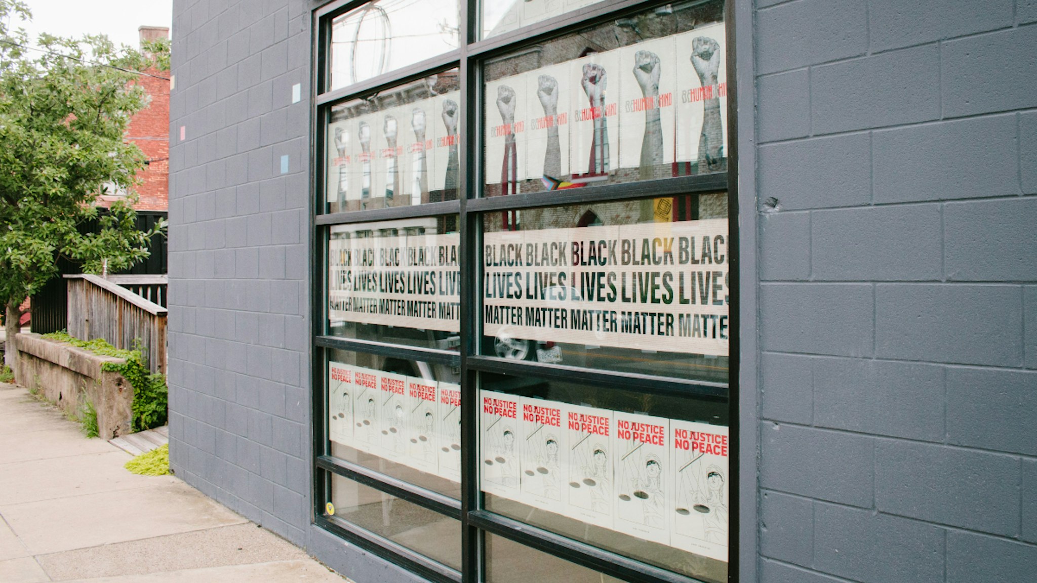 Black Lives Matter signs are displayed in the window of a business in the East Market District (also referred to as NuLu neighborhood) in Louisville,