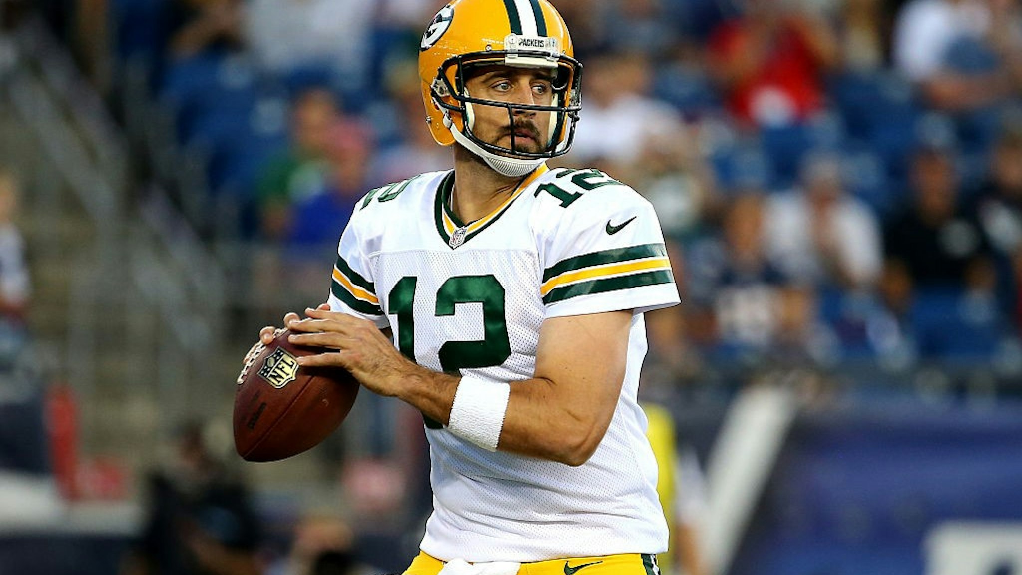FOXBORO, MA - AUGUST 13: Aaron Rodgers #12 of the Green Bay Packers drops back to pass in the first quarter against the New England Patriots during a preseason game at Gillette Stadium on August 13, 2015 in Foxboro, Massachusetts. (Photo by