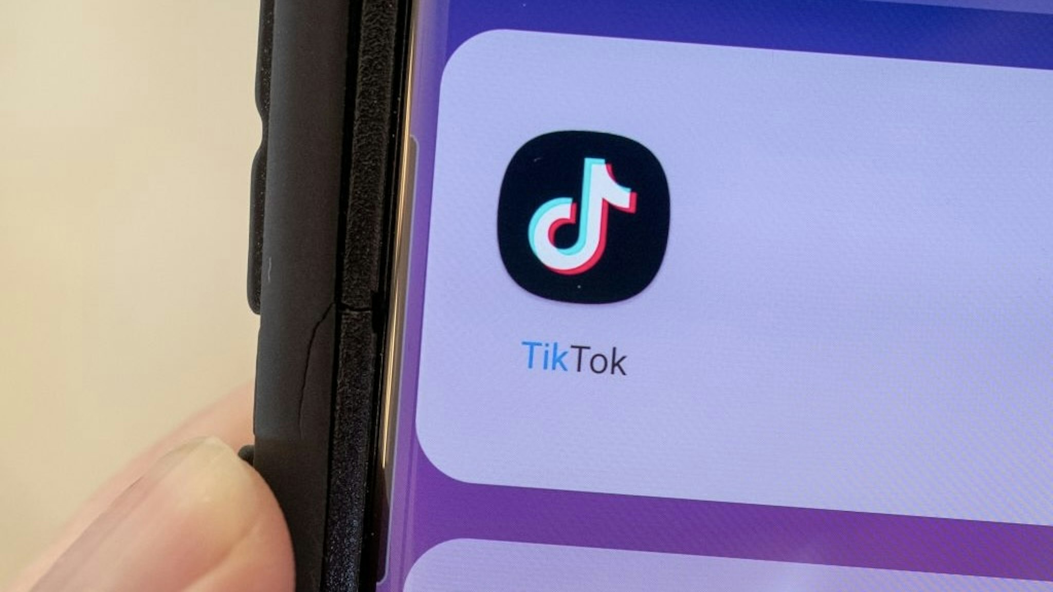 Tiktok Close-up of human hand holding a cellphone displaying icon for the TikTok video sharing app, Lafayette, California, September 22, 2021. (Photo by Smith Collection/Gado/Getty Images) Smith Collection/Gado / Contributor