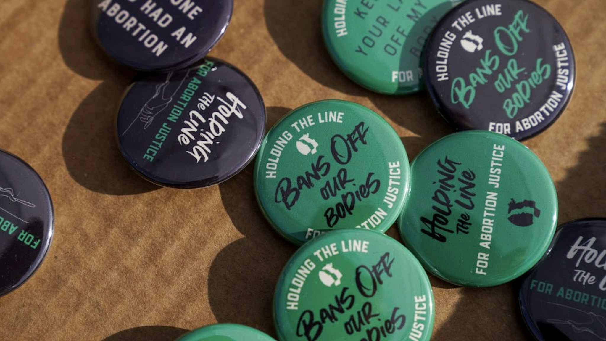Women's March "Hold The Line For Abortion Justice" At The Supreme Court During Jackson Women's Health Organization v. Dobbs Hearing WASHINGTON, DC - DECEMBER 01: Buttons are given out during the Women's March "Hold The Line For Abortion Justice" at Union Station on December 01, 2021 in Washington, DC. (Photo by Leigh Vogel/Getty Images for Women's March Inc) Leigh Vogel / Stringer