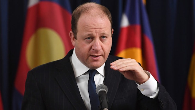 Gov. Jared Polis and officials announced Denver and a number of other Colorado counties will be moved to Level Red on a newly revamped version of the state"u2019s color-coded COVID-19 dial at Boettcher Mansion in Denver, Colorado on Tuesday.