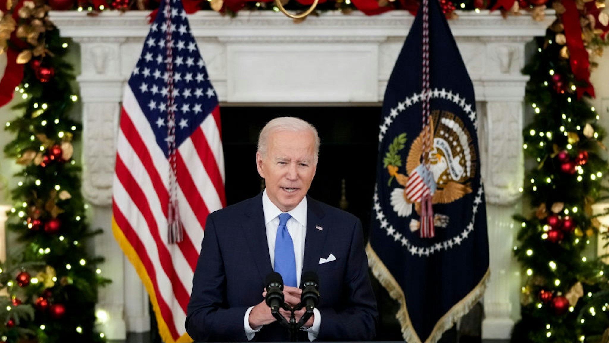 WASHINGTON, DC - DECEMBER 21: U.S. President Joe Biden speaks about the omicron variant of the coronavirus in the State Dining Room of the White House, December 21, 2021 in Washington, DC. As the omicron variant fuels a new wave of COVID-19 infections, Biden announced plans that will expand testing sites across the country, distribute millions of free at-home tests and boost federal resources to hospitals in need.