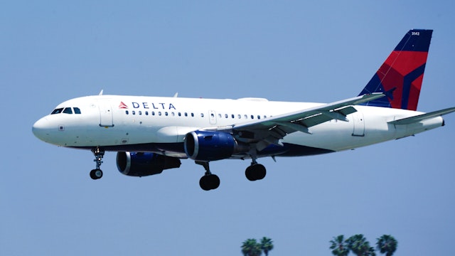 An Airbus SE A310-114 aircraft, operated by Delta Air Lines Inc., flies into San Diego International Airport (SAN) in San Diego, California, U.S., on Monday, April 27, 2020. U.S. airlines reached preliminary deals to access billions of dollars in federal aid, securing a temporary lifeline as the industry waits for customers to start flying again.