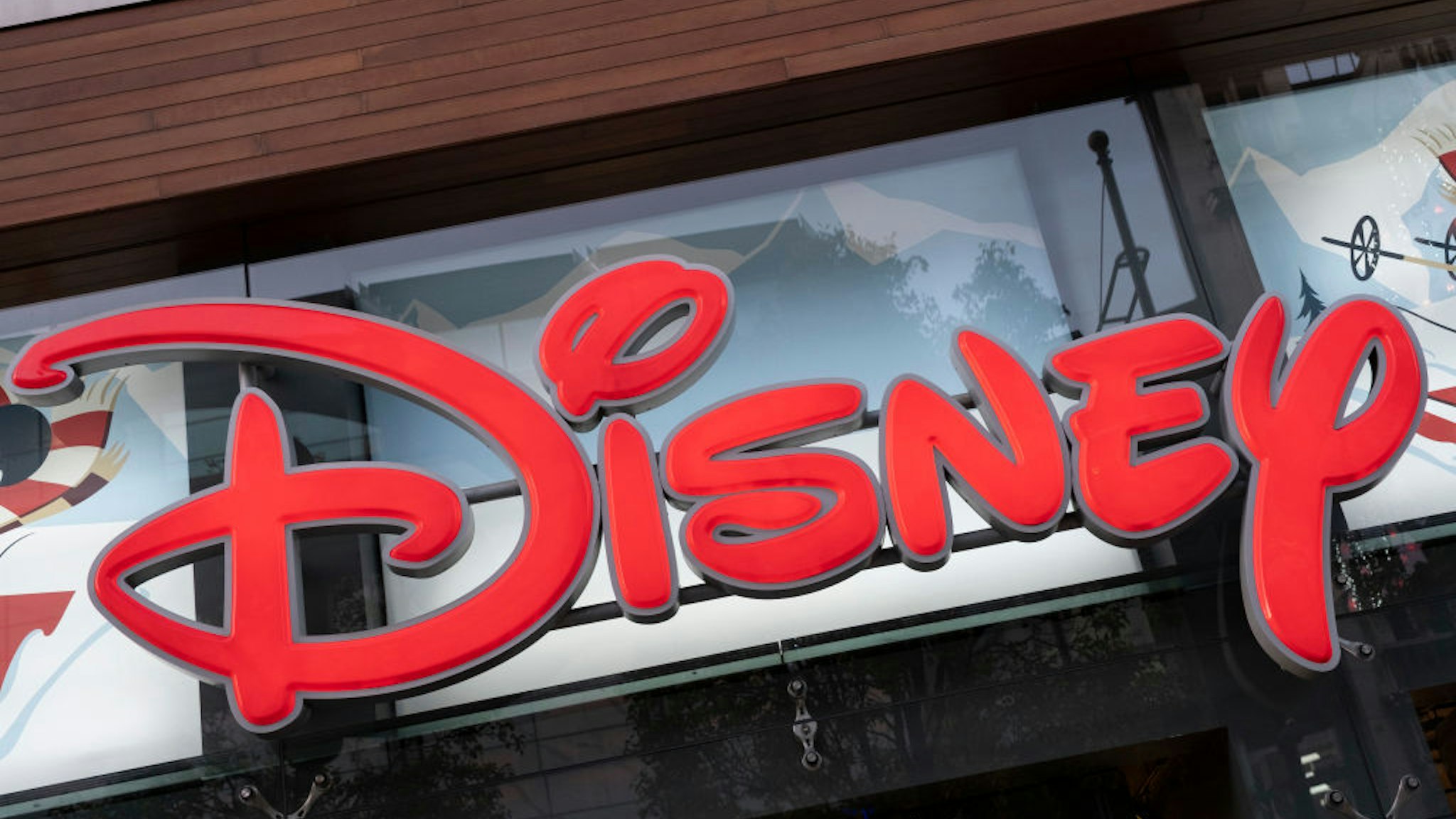 Sign for the media brand Disney Store on 22nd November 2021 in London, United Kingdom. The Walt Disney Company, commonly known as Walt Disney or simply Disney, is an American diversified multinational mass media and entertainment conglomerate.