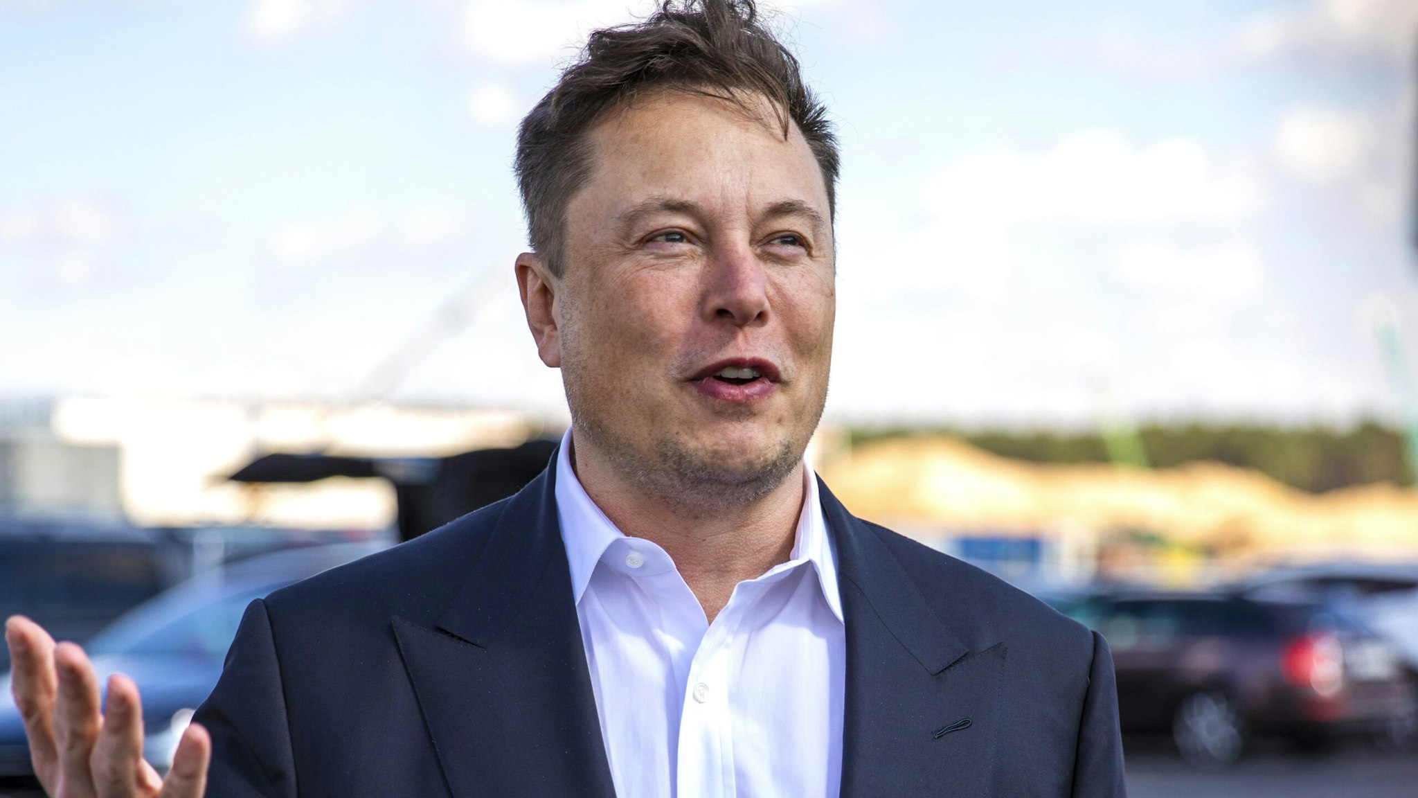 FUERSTENWALDE, GERMANY - SEPTEMBER 03: Tesla head Elon Musk arrives to have a look at the construction site of the new Tesla Gigafactory near Berlin on September 03, 2020 near Gruenheide, Germany. Musk is currently in Germany where he met with vaccine maker CureVac on Tuesday, with which Tesla has a cooperation to build devices for producing RNA vaccines, as well as German Economy Minister Peter Altmaier yesterday.