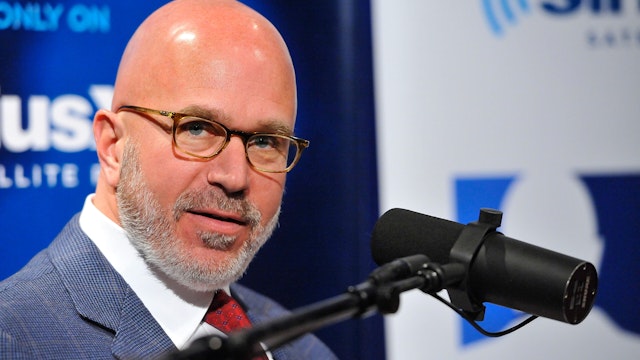 Michael Smerconish speaks with former Florida governor Charlie Crist during his visit to SiriusXM's "Book Club With Michael Smerconish" to discuss his new book "The Party's Over: How The Extreme Right Hijacked The GOP And I Became a Democrat" at SiriusXM Studio on February 6, 2014 in Washington, DC.