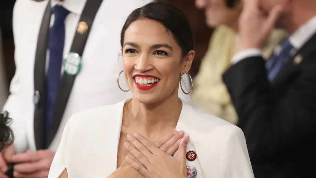 AOC Posts Photo Of Her ‘Glaring’ At Joe Manchin: Not ‘Obligated’ To Smile At People Doing ‘Hurtful Things’