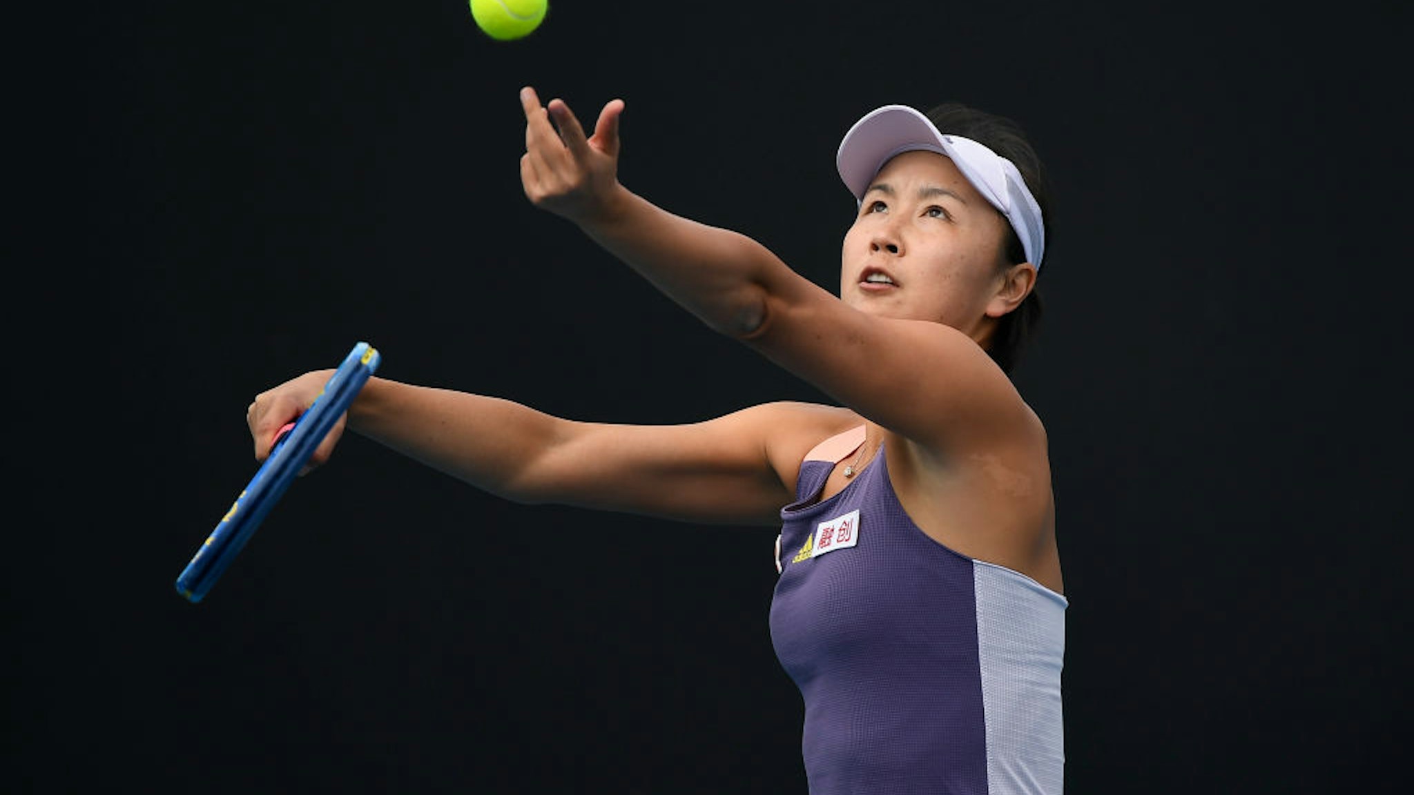 MELBOURNE, AUSTRALIA - JANUARY 21: Shuai Peng of China in action during her Women's Singles first round match against Nao Hibino of Japan on day two of the 2020 Australian Open at Melbourne Park on January 21, 2020 in Melbourne, Australia. (Photo by Fred Lee/Getty Images)