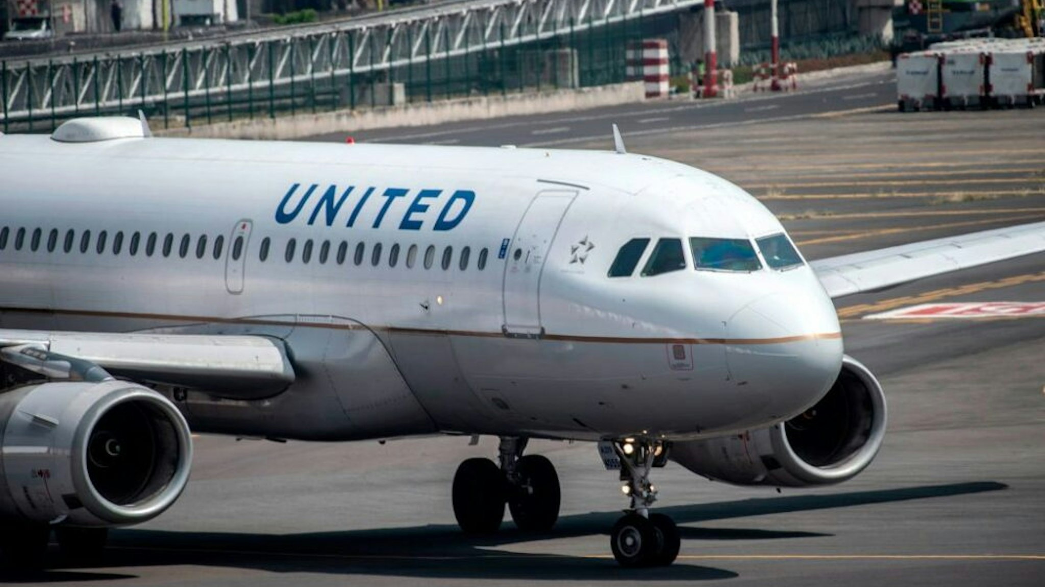 A United Airlines plane prepares to take off at the Benito Juarez International airport in Mexico City, on March 20, 2020. - International flights keep operating in Mexico, unlike most other countries which have closed airports due to the outbreak of the new coronavirus, COVID-19.