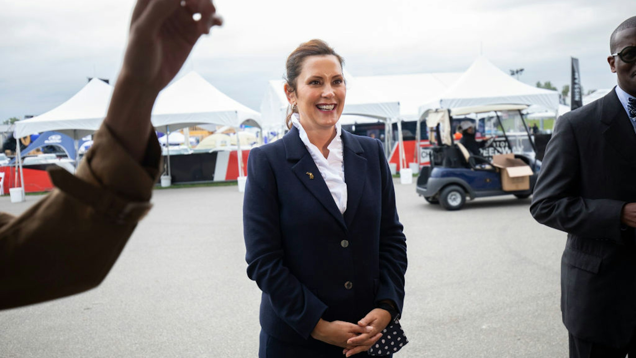 PONTIAC, MI - SEPTEMBER 21: Michigan Governor Gretchen Whitmer speaks with the news media at the 2021 Motor Bella auto show on September 21, 2021 in Pontiac, Michigan. The outdoor show runs from September 21 to September 26 and features over 350 cars, trucks, and utility vehicles on display, ride-along opportunities with professional drivers on a hot laps track, test drives, off-road track activations, and unique technology displays. (Photo by Bill Pugliano/Getty Images)