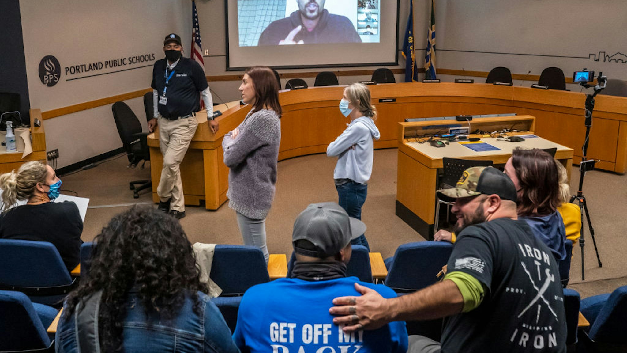 Anti-vaccine mandate protesters gather during a Portland Public Schools board meeting to discuss a proposed vaccine mandate for students on October 26, 2021 in Portland, Oregon.