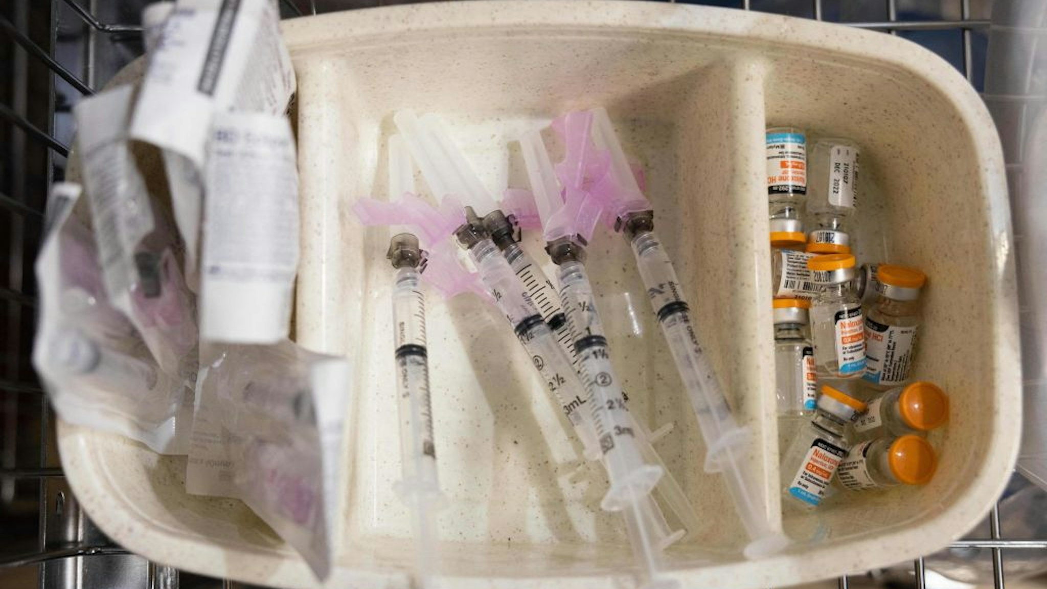In this November 30, 2021 photo, syringes and vials of Naloxone are shown during the media tour of the supervised drug injection site OnPoint, in New York.