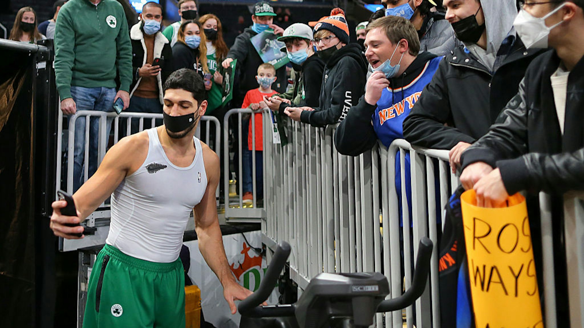 Boston - December 18: Boston Celtics Enes Kanter Freedom takes a selfie with Knicks fans before he went to visit the locker room before the game. The Boston Celtics host the New York Knicks in an NBA game at TD Garden in Boston on Dec. 18, 2021. (Photo by John Tlumacki/The Boston Globe via Getty Images)