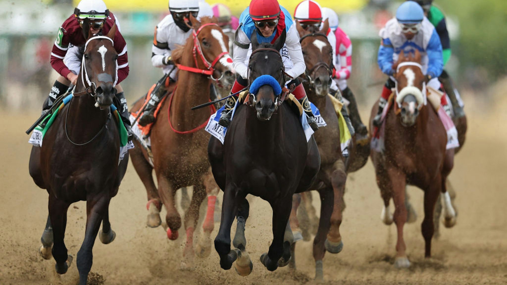 BALTIMORE, MARYLAND - MAY 15: Jockey John Velazquez #3 riding Medina Spirit leads the field in the first pass during the 146th Running of the Preakness Stakes at Pimlico Race Course on May 15, 2021 in Baltimore, Maryland. (Photo by Patrick Smith/Getty Images)