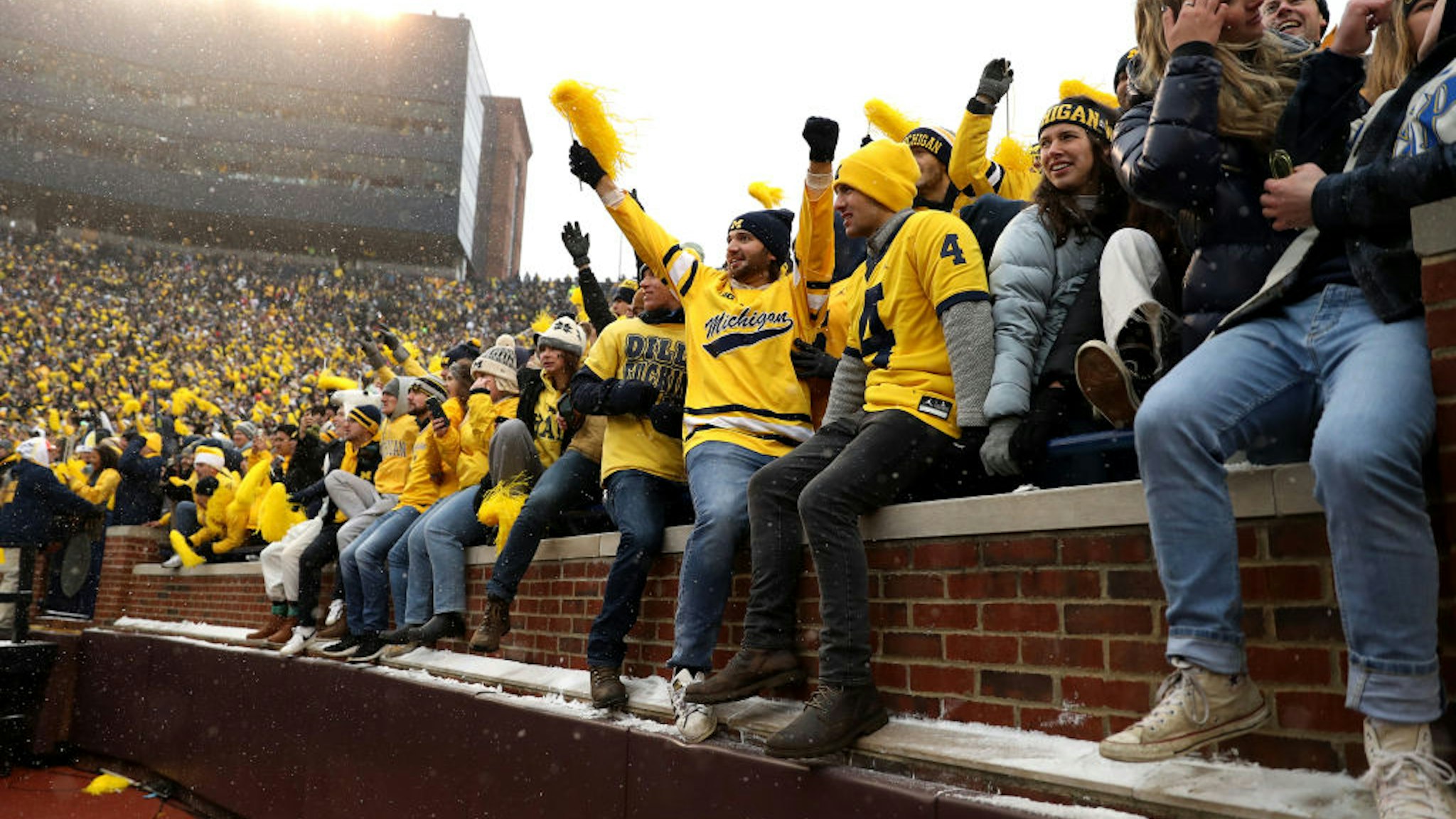 ANN ARBOR, MICHIGAN - NOVEMBER 27: Michigan Wolverines fans prepare to storm the field after the Wolverines victory over the Ohio State Buckeyes at Michigan Stadium on November 27, 2021 in Ann Arbor, Michigan. (Photo by Mike Mulholland/Getty Images)