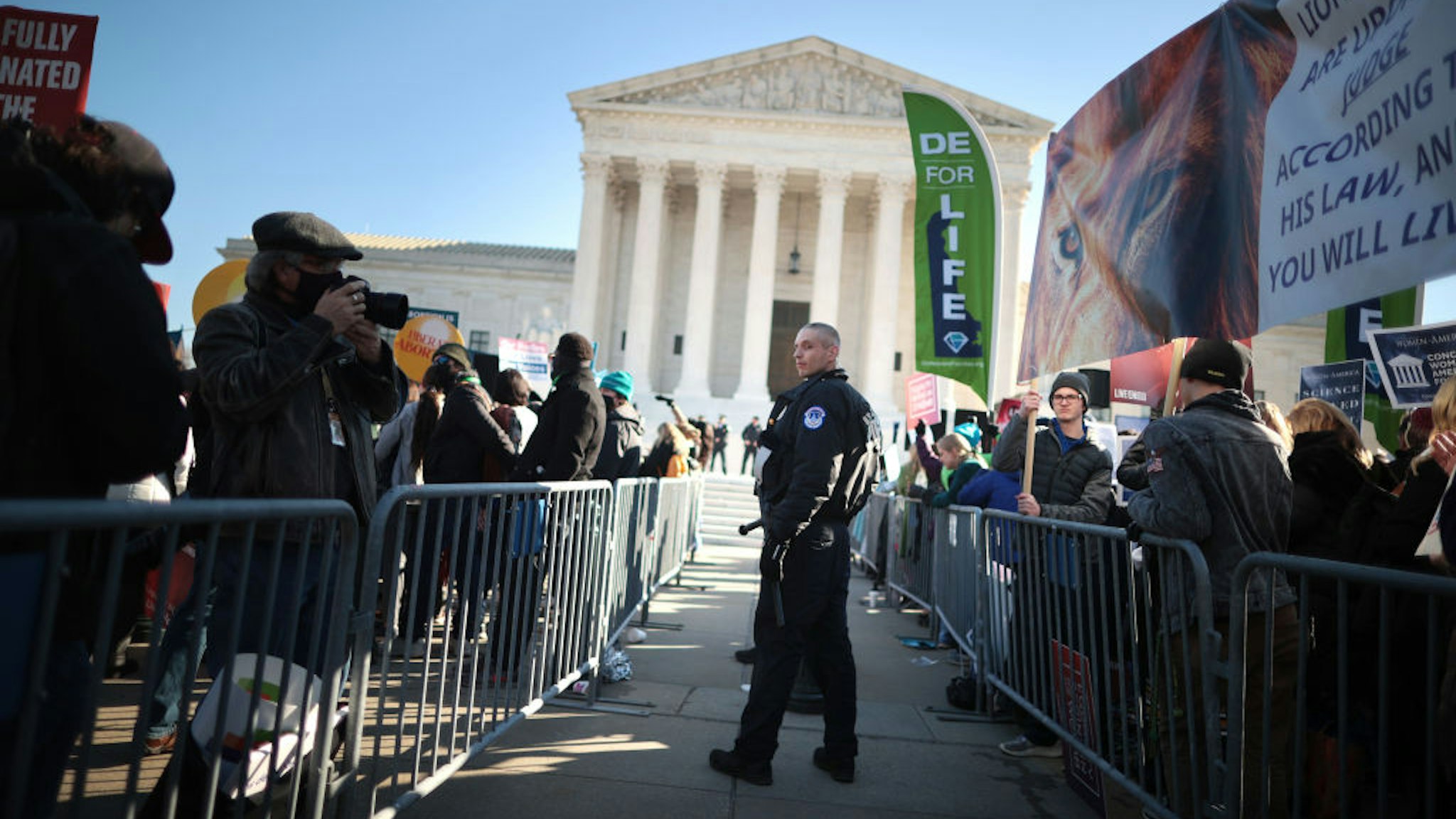 WASHINGTON, DC - DECEMBER 01: Police use metal barricades to keep protesters, demonstrators and activists apart in front of the U.S. Supreme Court as the justices hear hear arguments in Dobbs v. Jackson Women's Health, a case about a Mississippi law that bans most abortions after 15 weeks, on December 01, 2021 in Washington, DC. With the addition of conservative justices to the court by former President Donald Trump, experts believe this could be the most important abortion case in decades and could undermine or overturn Roe v. Wade. (Photo by Chip Somodevilla/Getty Images)
