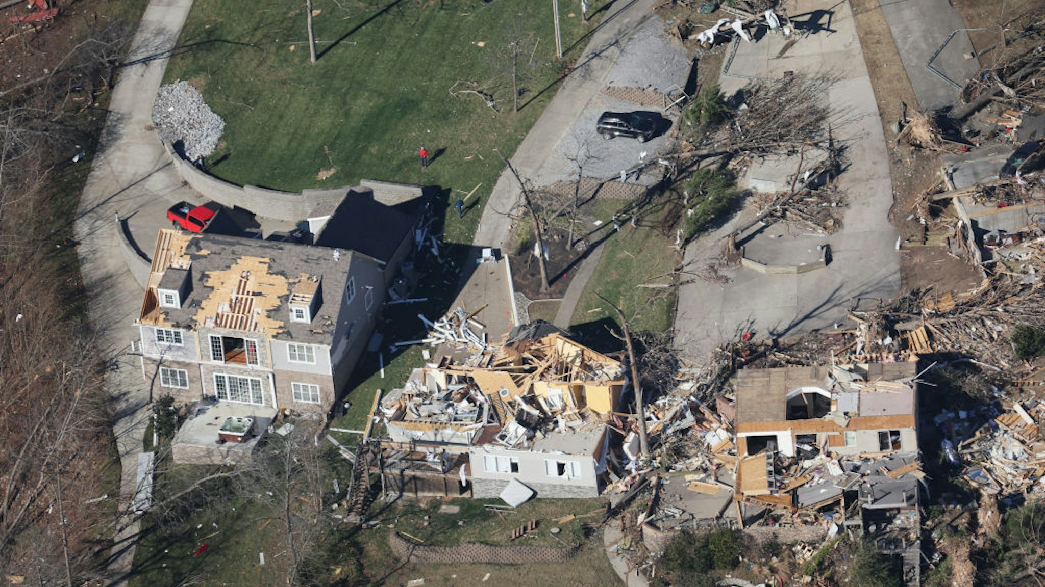 In this aerial view, homes and surrounding area are heavily damaged after they were hit by a tornado three days prior, on December 13, 2021 near Calvert City, Kentucky.