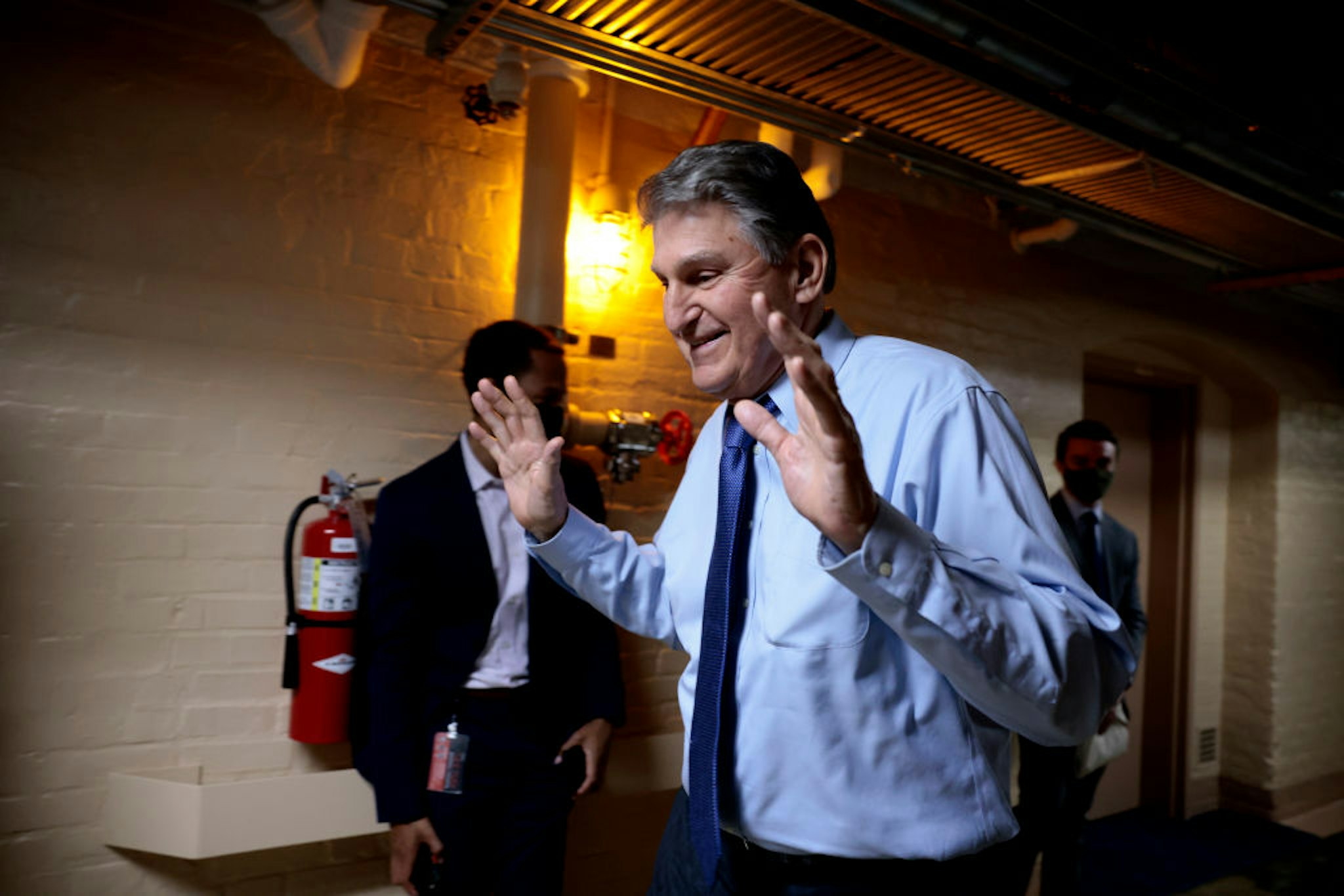 WASHINGTON, DC - DECEMBER 15: Sen. Joe Manchin (D-WV) walks out of a meeting with fellow Democratic senators for a break in the basement of the U.S. Capitol Building on December 15, 2021 in Washington, DC. The senators held the meeting to discuss senate rules with their staff members. (Photo by Anna Moneymaker/Getty Images)