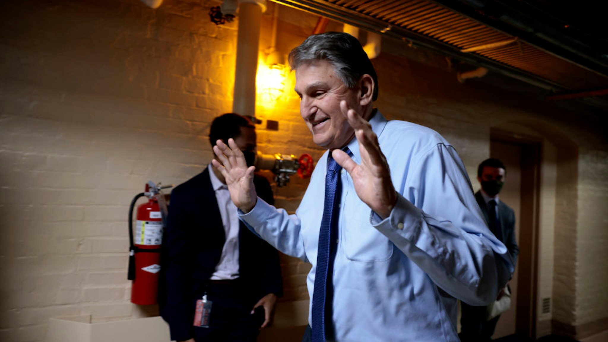 WASHINGTON, DC - DECEMBER 15: Sen. Joe Manchin (D-WV) walks out of a meeting with fellow Democratic senators for a break in the basement of the U.S. Capitol Building on December 15, 2021 in Washington, DC. The senators held the meeting to discuss senate rules with their staff members. (Photo by Anna Moneymaker/Getty Images)