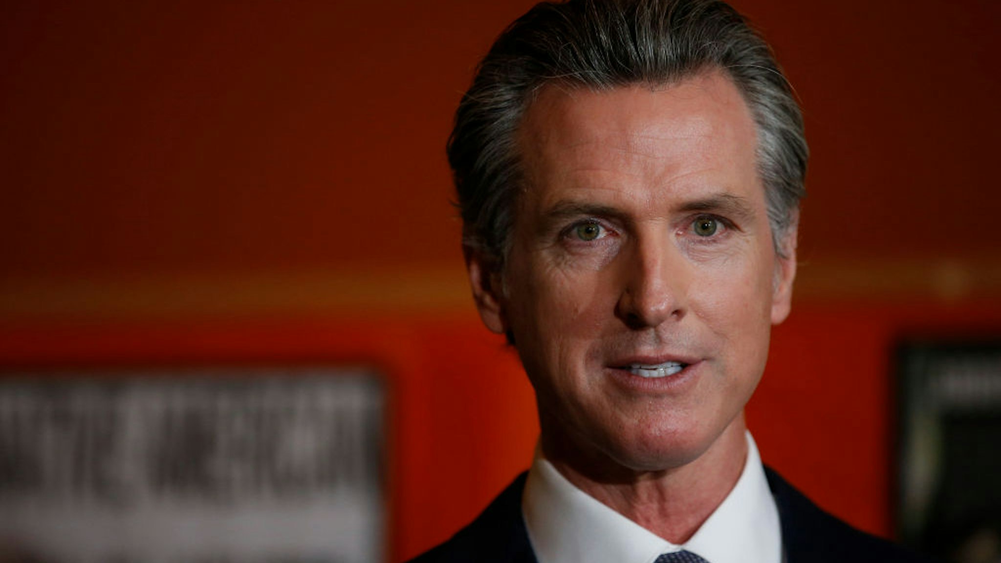 Gov. Gavin Newsom takes questions from the media during a press conference at the Native American Health Center in Oakland, Calif., on Wednesday, Dec. 22, 2021.