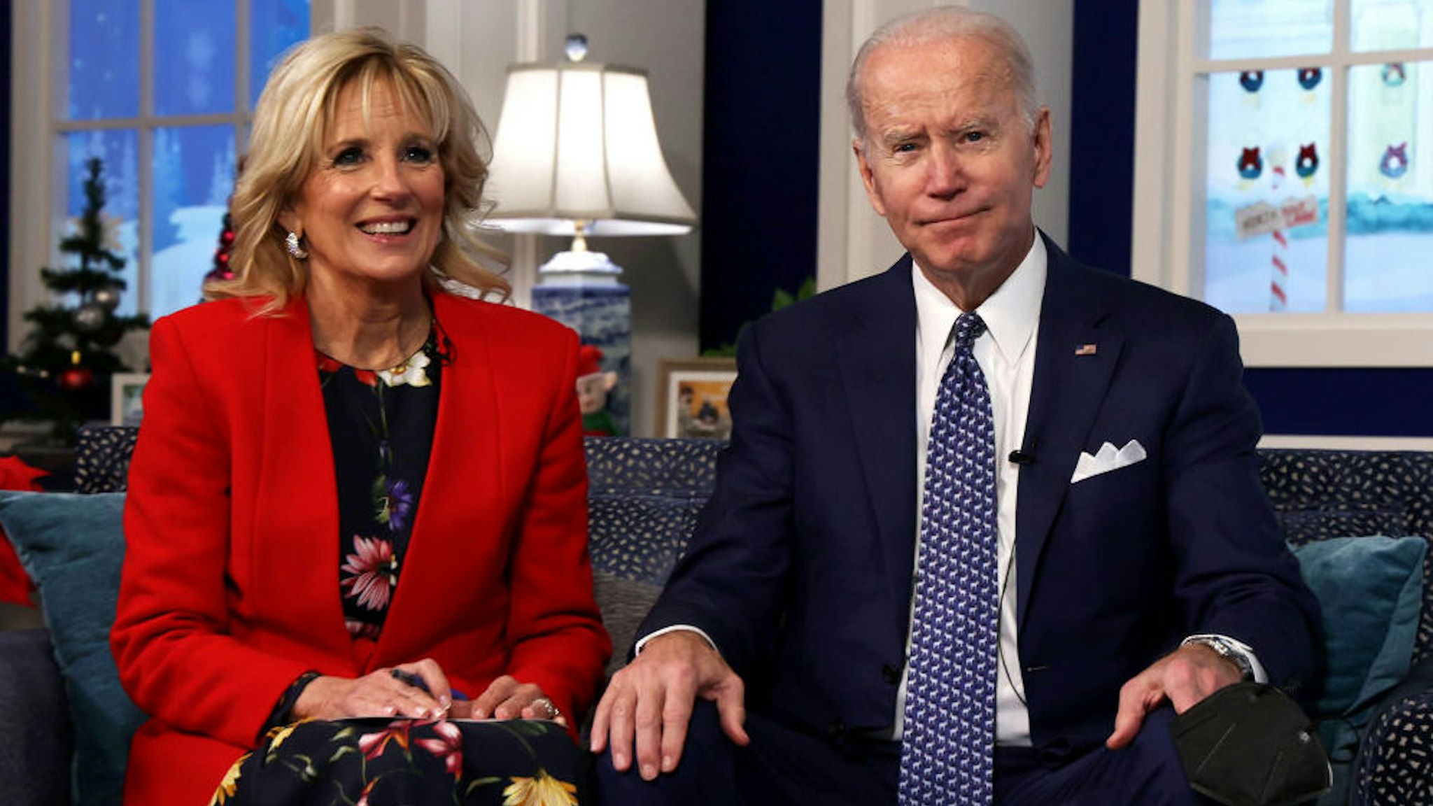 U.S. President Joe Biden and first lady Dr. Jill Biden participate in an event to call NORAD and track the path of Santa Claus on Christmas Eve in the South Court Auditorium of the Eisenhower Executive Building on December 24, 2021 in Washington, DC.