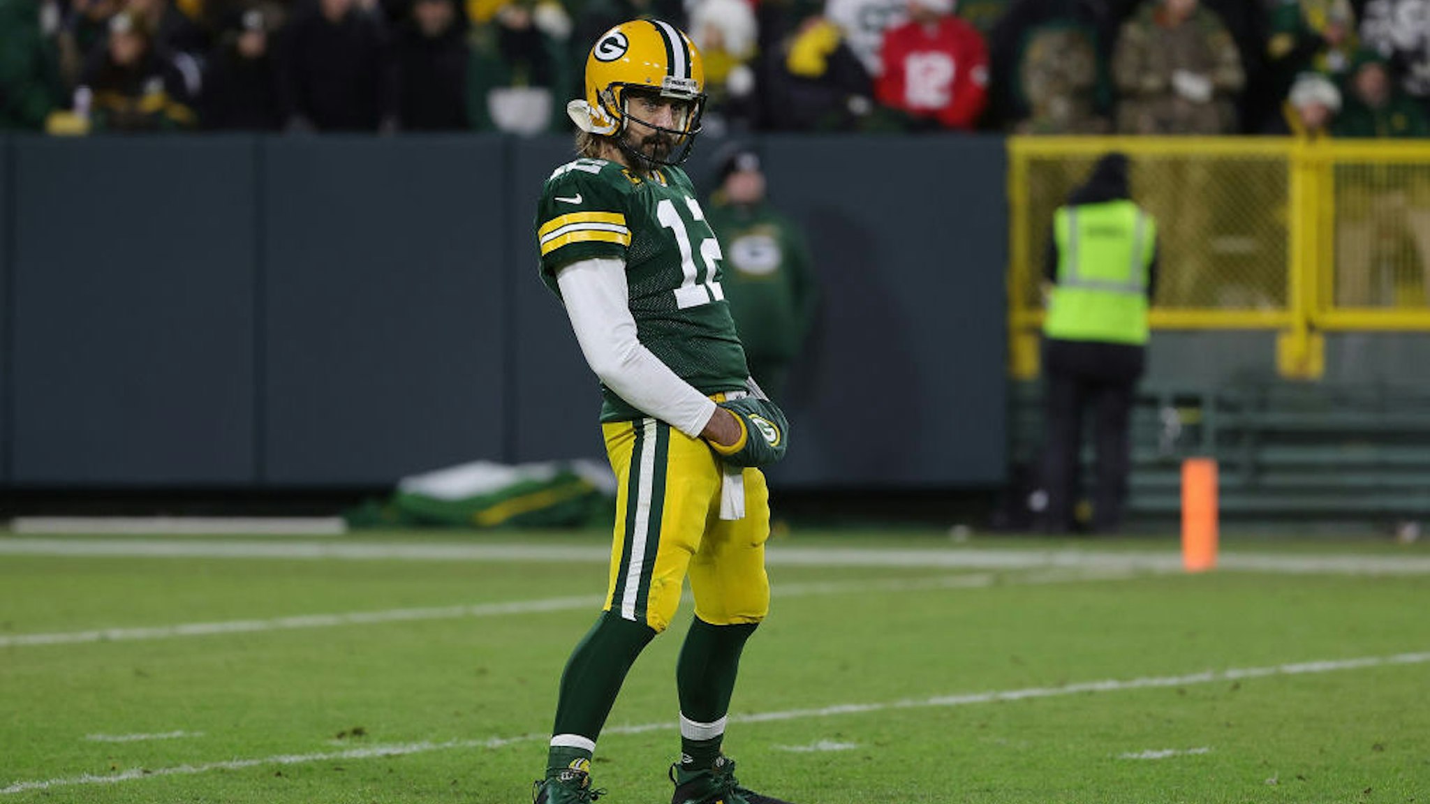 GREEN BAY, WISCONSIN - DECEMBER 25: Aaron Rodgers #12 of the Green Bay Packers waits for a timeout during a game against the Cleveland Browns at Lambeau Field on December 25, 2021 in Green Bay, Wisconsin. The Packers defeated the Browns 24-22. (Photo by Stacy Revere/Getty Images)