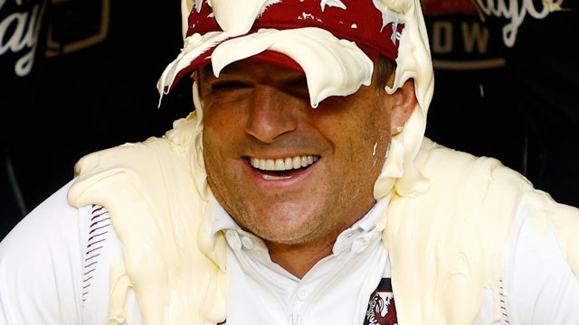 Head coach Shane Beamer of the South Carolina Gamecocks is covered in Duke's Mayonnaise following their 38-21 victory over the North Carolina Tar Heels in the Duke's Mayo Bowl at Bank of America Stadium on December 30, 2021 in Charlotte, North Carolina